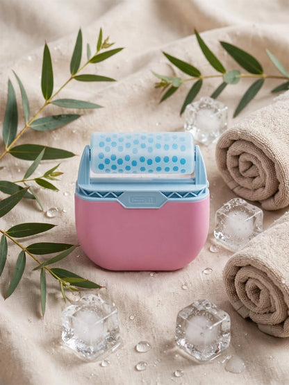 Solaara Chill Roller in pink and blue on a linen towel with eucalyptus leaves, rolled towels and ice cubes